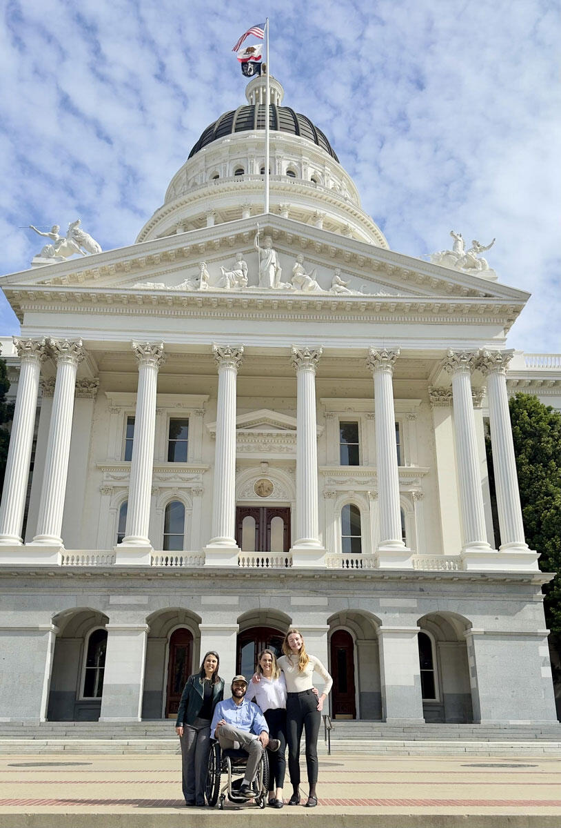 Attendees of the California Academy Advocacy Summit pose for a picture in front of the Plaza de California building