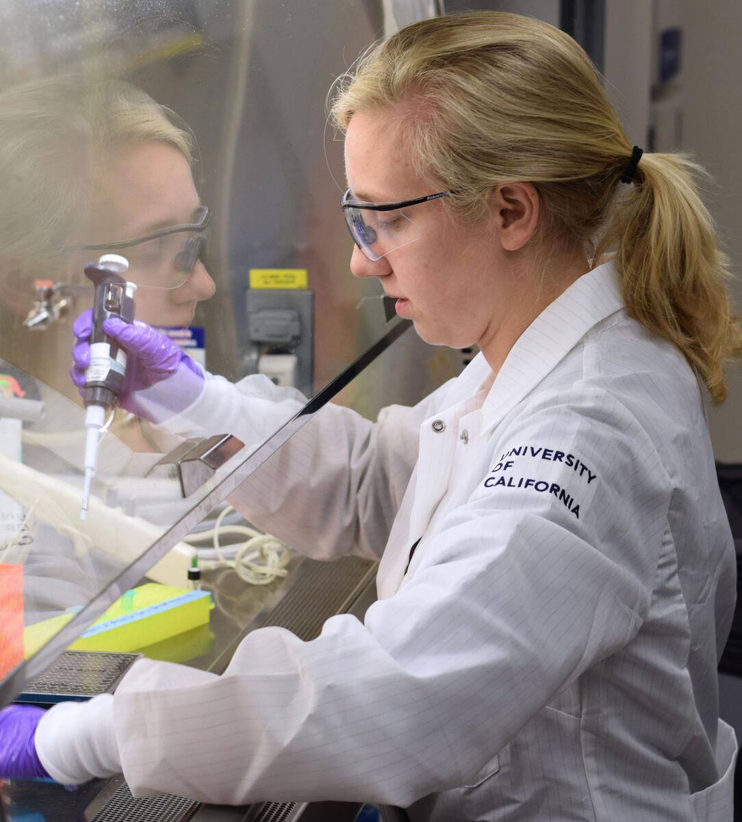 A photo of a student researcher in a lab.