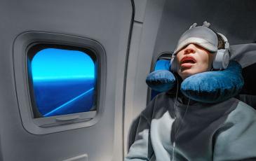 person sleeping on plane 